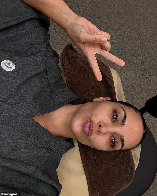 Kardashian looked to have very clear skin as she added mauve lipstick