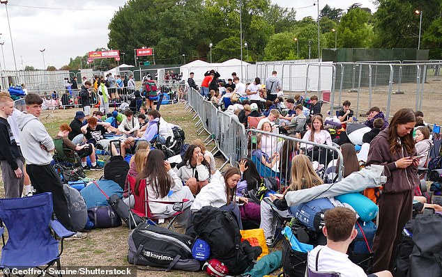 Reading Festival fans begin to arrive for the early bird camping on an overcast morning