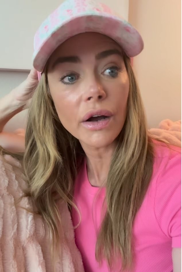 . 'This has been a very difficult time and there are circumstances around my divorce that are difficult to talk about, which one day I will talk about,' she said as she was interrupted by a dog barking.