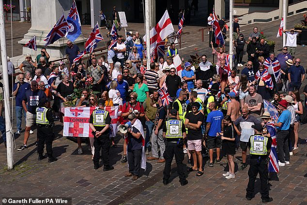 Anti-migrant protesters gathering in Guildhall Square in Portsmouth this afternoon