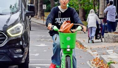 Iris Law cut a casual figure as she wobbled through busy traffic on a punctured Lime Bike in central London on Thursday