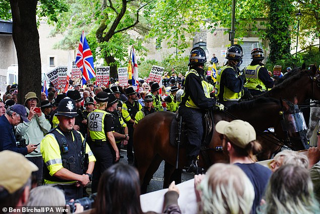 Mounted police officers are deployed during a protest by Abolish Asylum System and counter demonstrators at Castle Park in Bristol