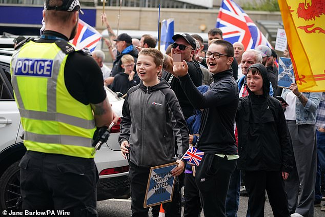 Children were among those attending a protest in Perth and were seen jeering and making obscene hand gestures at counter-protesters
