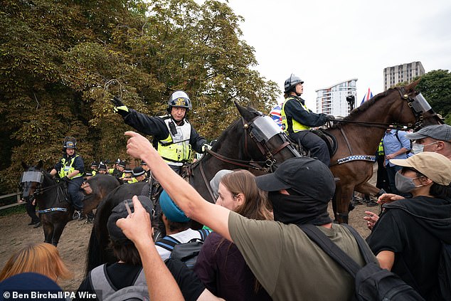 Mounted police officers are deployed during a protest by Abolish Asylum System and counter demonstrators at Castle Park in Bristol