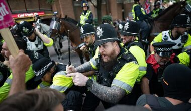 Mounted police officers scuffle with demonstrators during a protest by Abolish Asylum System and counter protesters at Castle Park in Bristol
