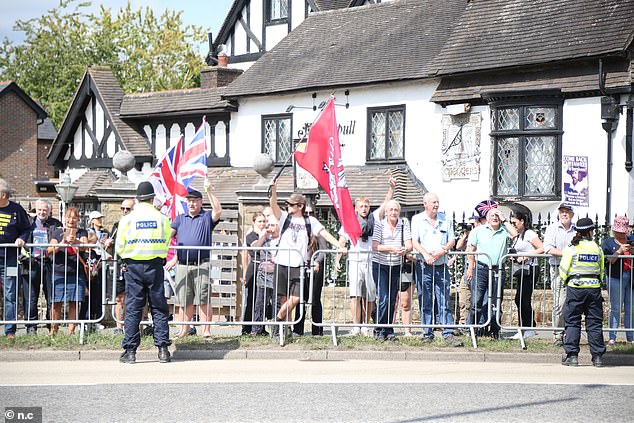 People demonstrating outside the asylum hotel in Horley