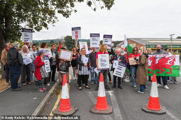 Hundreds of people turned up to protest against Home Office plans to house asylum seekers in flats in the town centre of Mold, North Wales