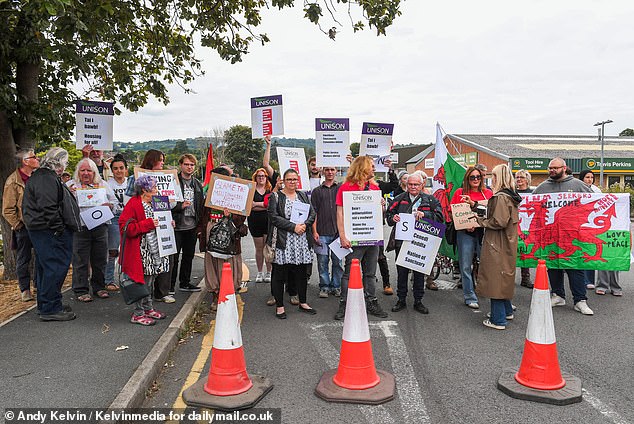 Hundreds of people turned up to protest against Home Office plans to house asylum seekers in flats in the town centre of Mold, North Wales on Saturday