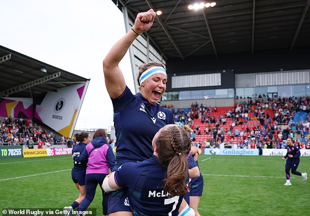Captain Malcolm is hoisted into the air at full-time as Scotland celebrate their victory