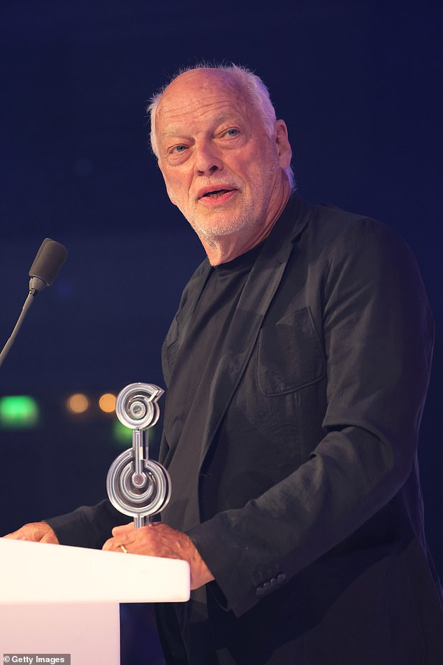 Pink Floyd guitarist David Gilmour (pictured) is one of Rayner's nearest big-name neighbours and lives only a couple of minutes' walk away. Pictured: Gilmour receiving the 'O2 Silver Clef Award' onstage in July 2025
