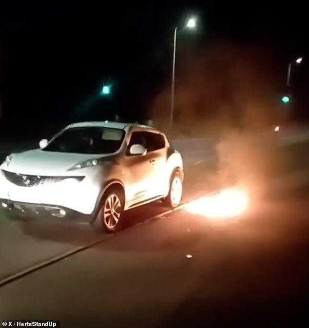 Footage from the incident posted on social media by StevenagePatriots shows the bottle ablaze on the ground and close to the rear tyres of a parked car
