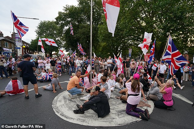 Large crowds took a seat on a local roundabout as protests ramped up in Epping