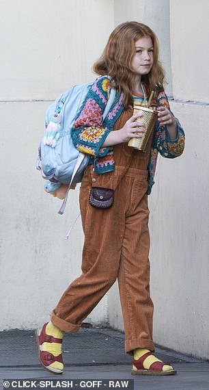 Meanwhile Ginny was dressed in orange dungarees and a colourful crochet cardigan along with clashing yellow socks and red sandals