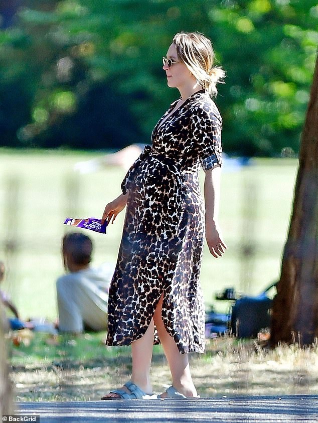 The actress, 31, looked chic in a leopard print shirt dress paired with trendy 90s-inspired sunglasses and light blue Birkenstock sandals