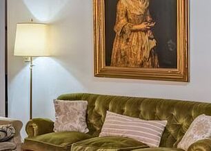 'Portrait of a Lady was pictured hanging over a sofa in a real estate listing posted by Robles Casas & Campos