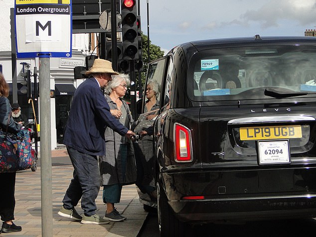 He was seen leaving Lavender Hill Magistrates¿ Court and getting into a taxi with wife, Anne, pictured