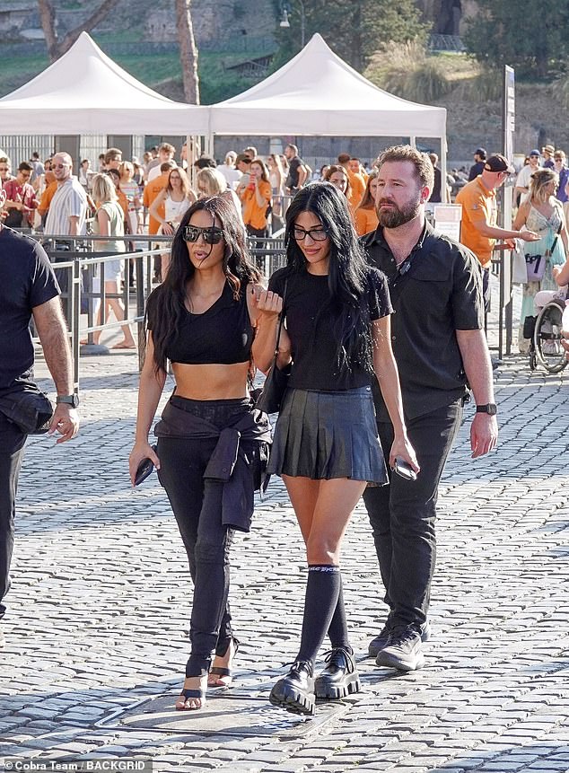 Kim, 44, opted for an ultra-casual all-black ensemble for the outing, while her daughter contrasted her with a more colorful look
