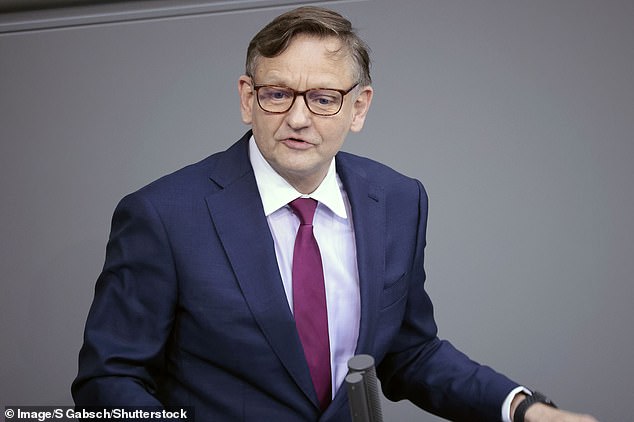Fiercely anti-migrant AfD, earlier this month, topped a poll as the country's most popular political party (pictured: Kay Gottschalk of AfD in 2022)