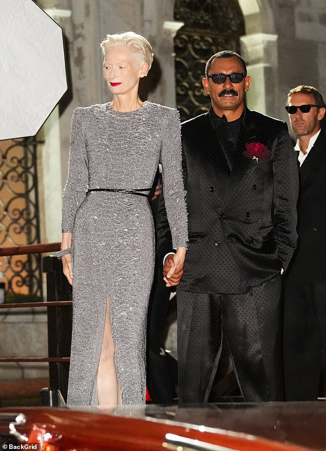 Also in attendance was Tilda, 64, who arrived holding hands with Tom Ford's creative director, Haider Ackermann