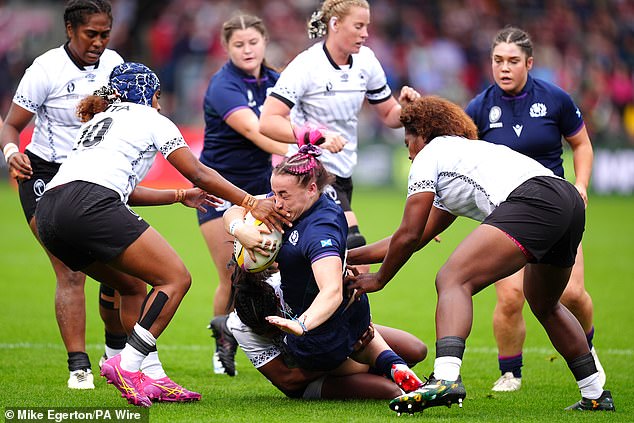 Evie Gallagher is tackled by a physical Fiji side who left nothing behind in pursuit of an upset