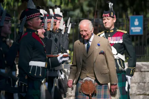 PA Media King Charles III inspects the Balaklava Company, 5th Battalion, The Royal Regiment of Scotland, at the gates of Balmoral.