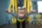 A Down syndrome child taking part in a physical exercise in the classroom