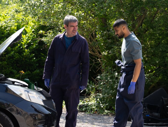 Cain speaks to Kammy outside the garage in Emmerdale