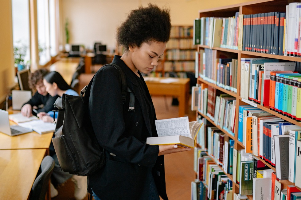 woman, library, reading, intellectual freedom, public
