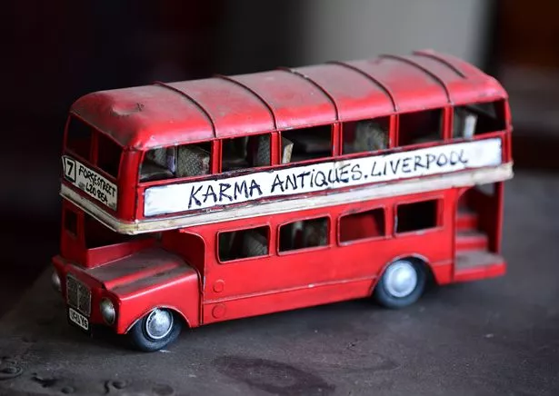 Old double decker bus toy at Karma Antiques