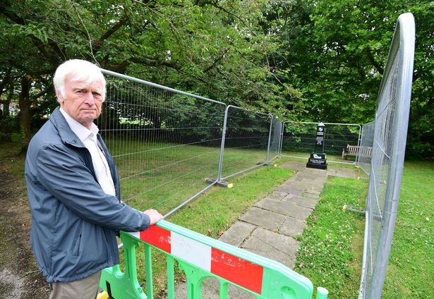 John Herbert with the fenced off Scarisbrick World War 1 Memorial, at The Venue (Village Hall)