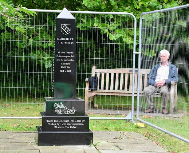 John Herbert with the fenced off Scarisbrick World War 1 Memorial, at The Venue (Village Hall)