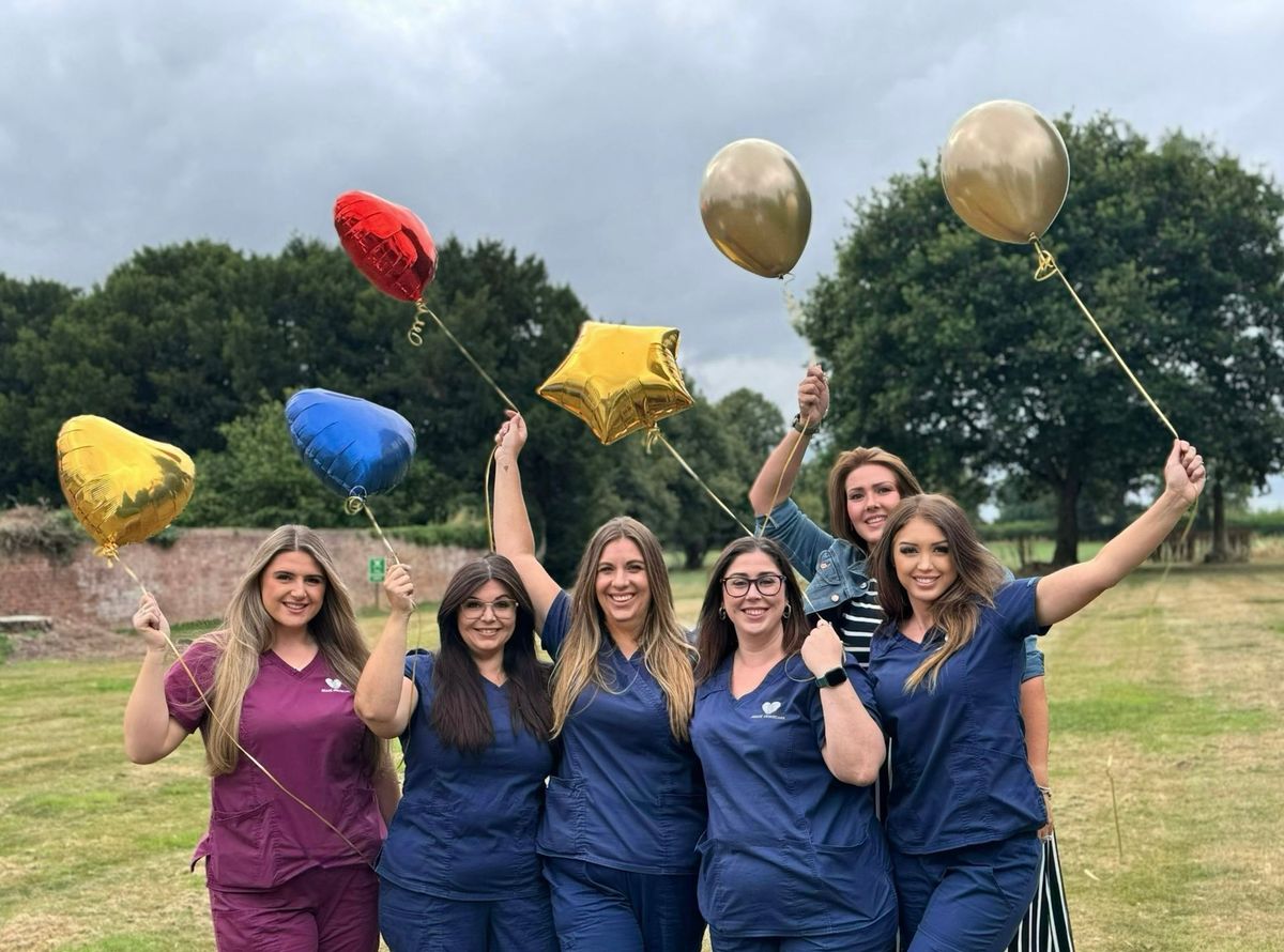 Miah Worley, Zoe Knowlton, Samantha Pizzey, Gemma Salmon, Roni Jones and Siobhan Mills celebrating the award at the office in Hadnall.