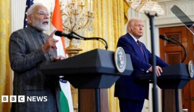 Donald Trump listens as Indian Prime Minister Narendra Modi speaks during a joint press conference at the White House in Washington