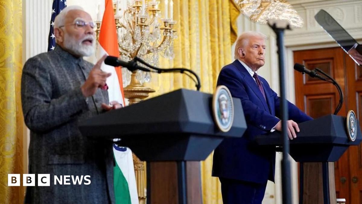 Donald Trump listens as Indian Prime Minister Narendra Modi speaks during a joint press conference at the White House in Washington