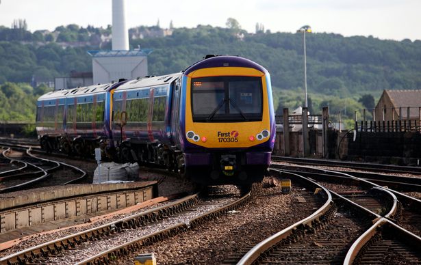 A Trans Pennine Express train leaves Huddersfield train station in Huddersfield, 
