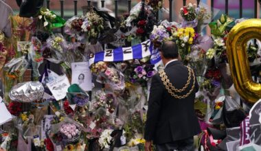 The lord mayor of Birmingham Zafar Iqbal views the messages and floral tributes left at the Black Sabbath Bridge bench on Broad Street in Birmingham in memory of Black Sabbath frontman Ozzy Osbourne