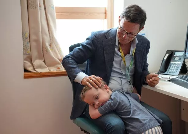 Conor with surgeon Conor Mallucci, who helped operate him and save his life