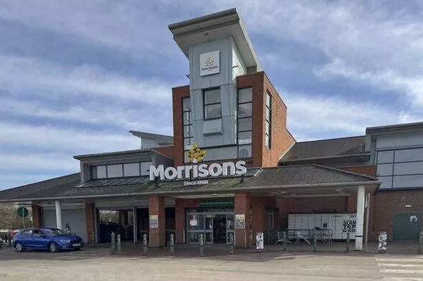 Exterior view of the front entrance of the Morrisons supermarke