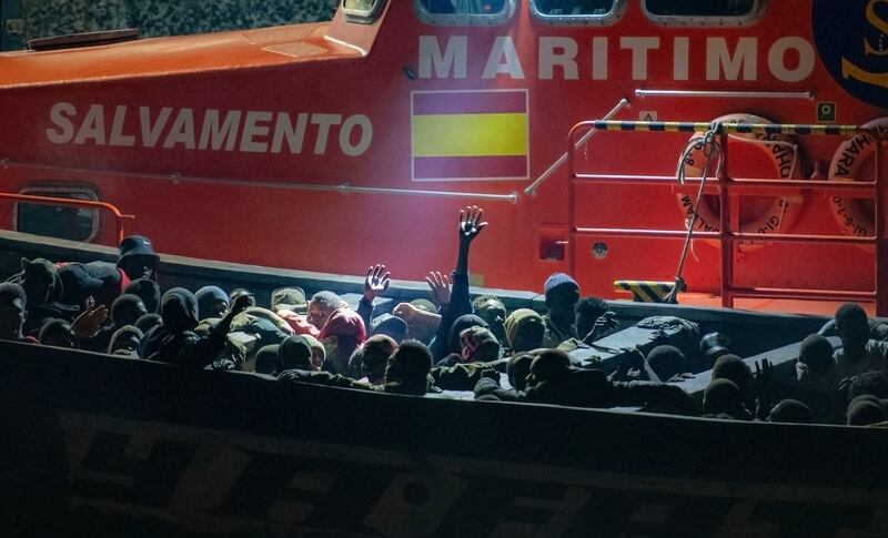 More than 100 migrants -  17 of them minors - wait to disembark from  a "cayuco" boat that arrived last September, 2024 in the Canary Islands. Photograph: Antonio Sempere/ AFP