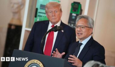 US President Donald Trump (L) listens as Nvidia CEO Jensen Huang speaks in the Cross Hall of the White House during an event on "Investing in America"