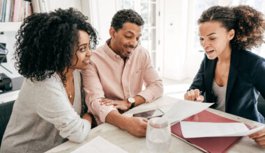 A couple speaking to their lawyer.