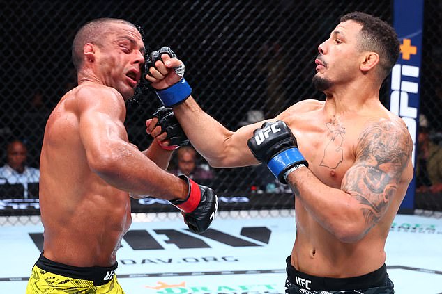 CHICAGO, ILLINOIS - AUGUST 16: (R-L) Drakkar Klose punches Edson Barboza of Brazil in a lightweight fight during the UFC 319 event at the United Center on August 16, 2025 in Chicago, Illinois. (Photo by Ed Mulholland/Zuffa LLC)