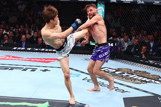 CHICAGO, ILLINOIS - AUGUST 16: Kai Asakura of Japan kicks Tim Elliott in a flyweight fight during the UFC 319 event at the United Center on August 16, 2025 in Chicago, Illinois. (Photo by Ed Mulholland/Zuffa LLC)