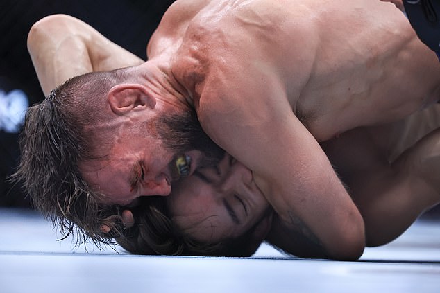 CHICAGO, ILLINOIS - AUGUST 16: Tim Elliott of the United States grapples with Kai Asakura of Japan during their flyweight bout during UFC 319 at the United Center on August 16, 2025 in Chicago, Illinois. (Photo by Geoff Stellfox/Getty Images)