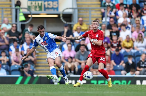 Blackburn Rovers' Dominic Hyam passes the ball under pressure from Birmingham City's Jay Stansfield