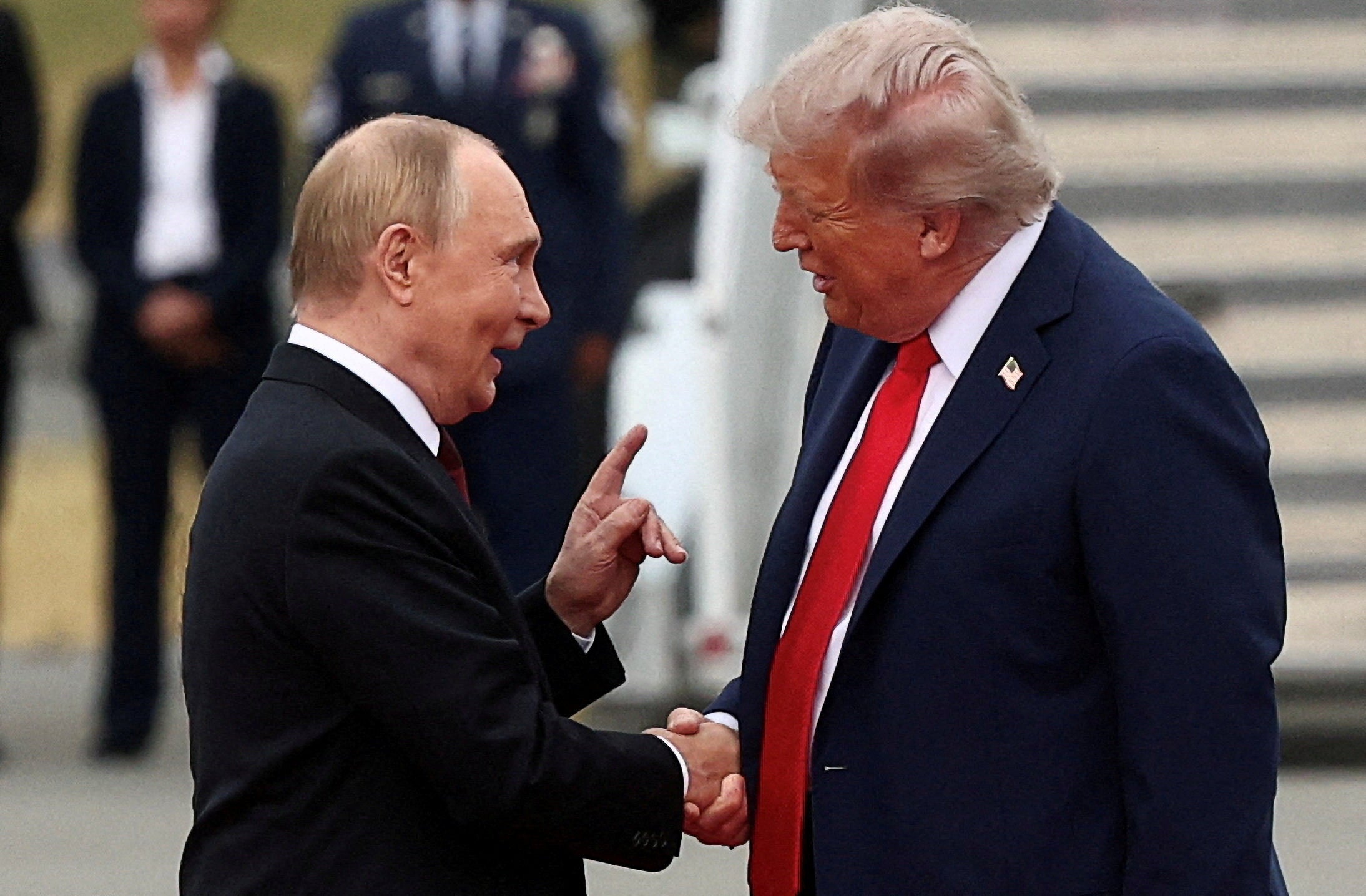 Putin and Trump shake hands during their Alaska meeting