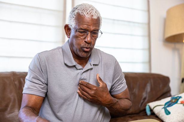 Person experiencing heart symptoms
