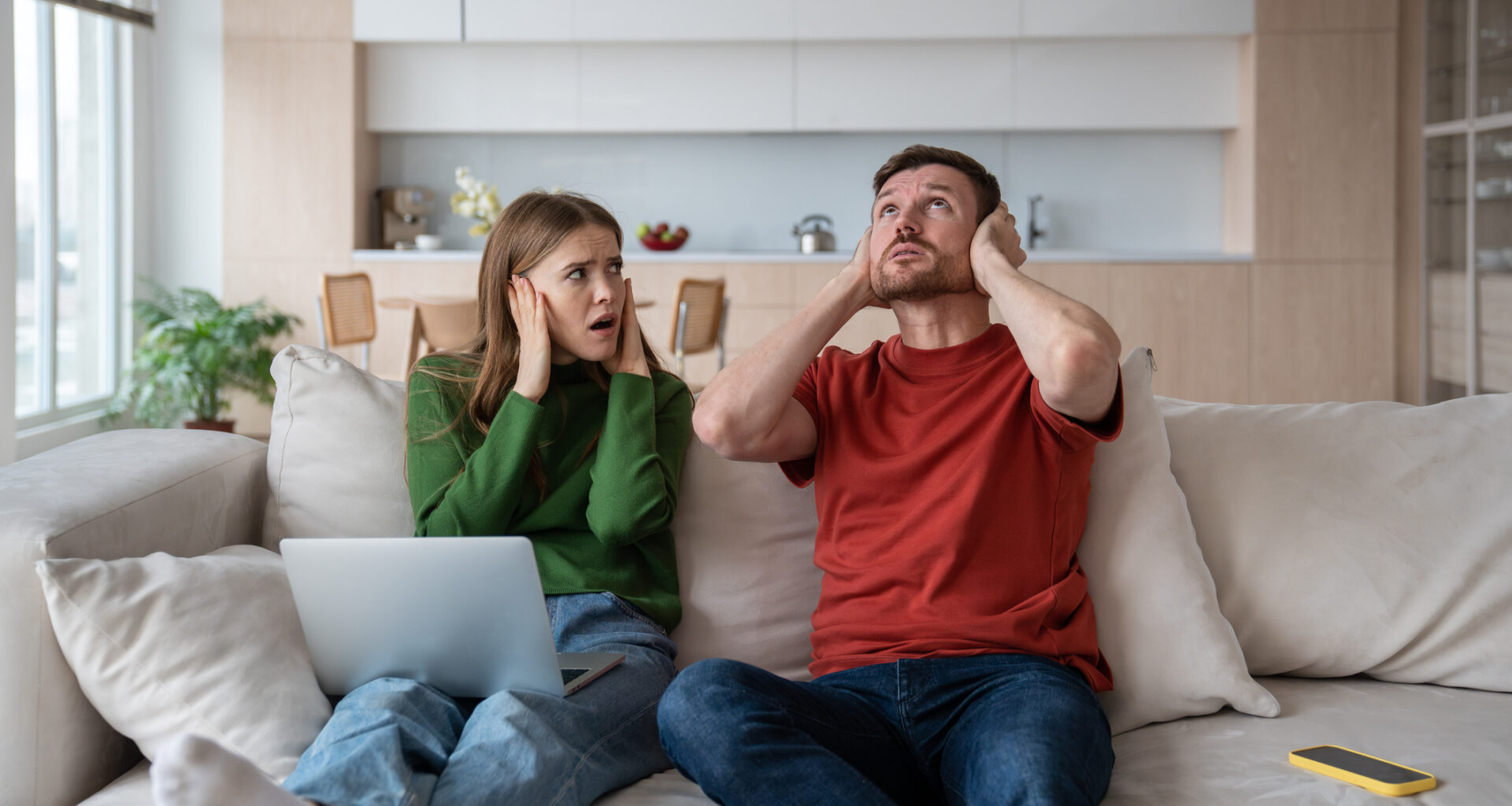 A couple react to noise from apartment