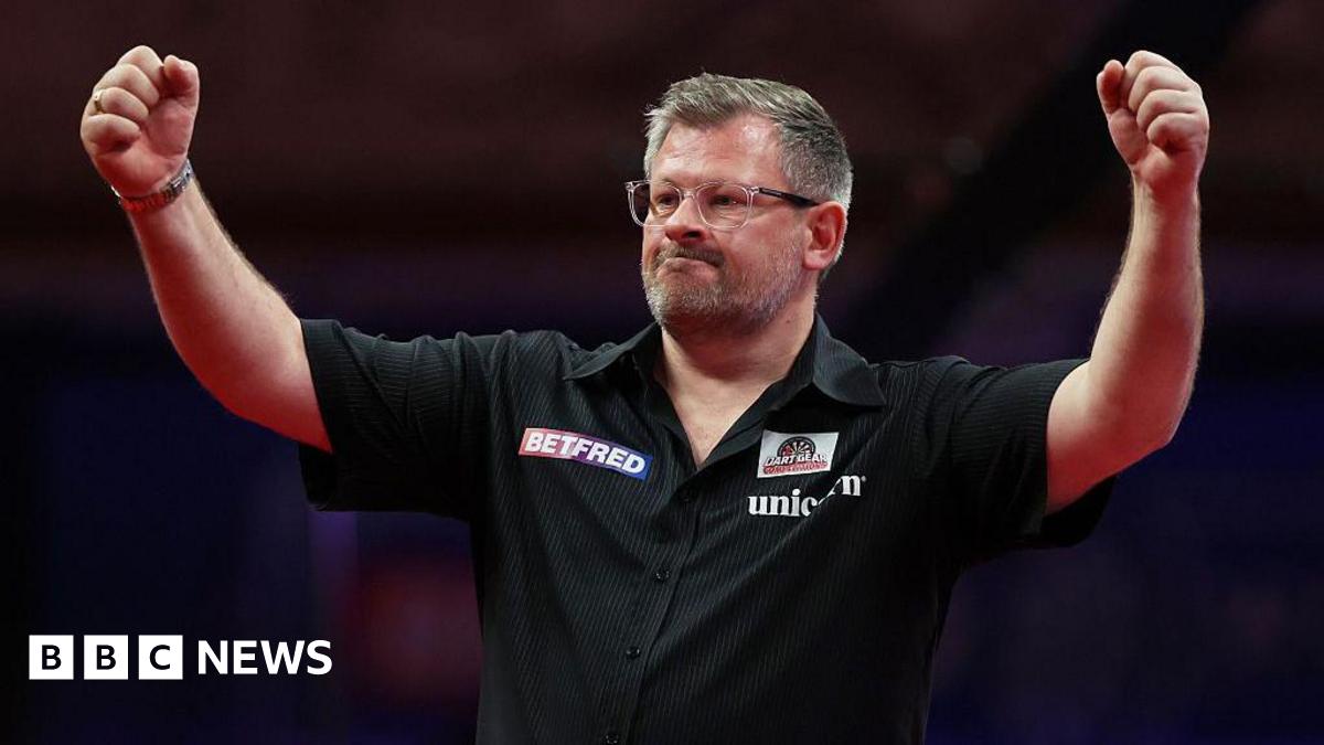 James Wade of England celebrates victory at Blackpool's Winter Gardens in July 2025