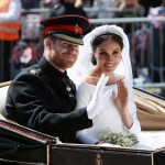 WINDSOR, ENGLAND - MAY 19: (EDITORS NOTE: Retransmission of #960087582 with alternate crop.) Prince Harry, Duke of Sussex and Meghan, Duchess of Sussex wave from the Ascot Landau Carriage during their carriage procession on Castle Hill outside Windsor Castle in Windsor, on May 19, 2018 after their wedding ceremony.